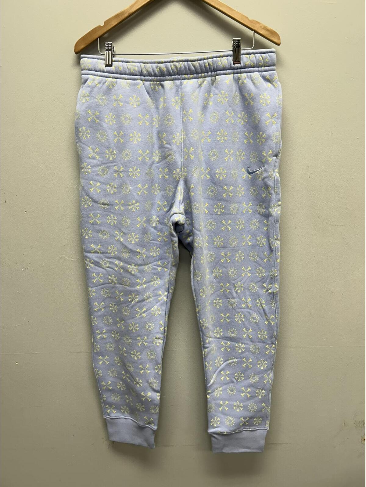 Nike Light Blue Sweatpants With Yellow Nike Swoosh Pattern